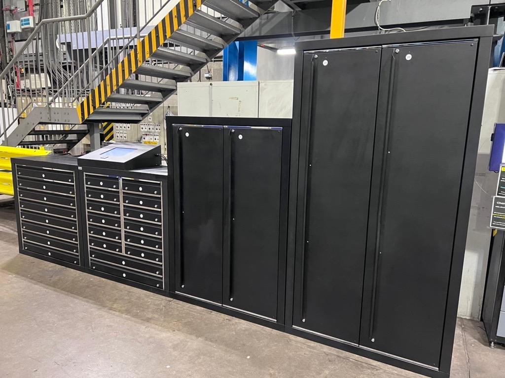 An integrated, multi-column bespoke iLockerz intelligent storage system installed at Baker Hughes, custom-configured with diverse drawer and locker compartment sizes for secure management of specialised tools and calibrated testing equipment.